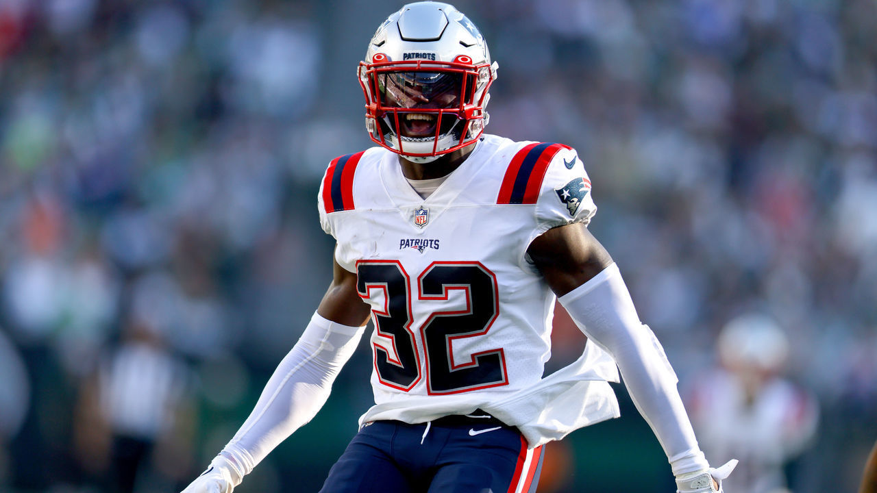 EAST RUTHERFORD, NEW JERSEY - OCTOBER 30: Devin McCourty #32 of the New England Patriots celebrates an interception during the second half against the New York Jets at MetLife Stadium on October 30, 2022 in East Rutherford, New Jersey.