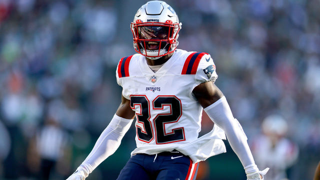 EAST RUTHERFORD, NEW JERSEY - OCTOBER 30: Devin McCourty #32 of the New England Patriots celebrates an interception during the second half against the New York Jets at MetLife Stadium on October 30, 2022 in East Rutherford, New Jersey.