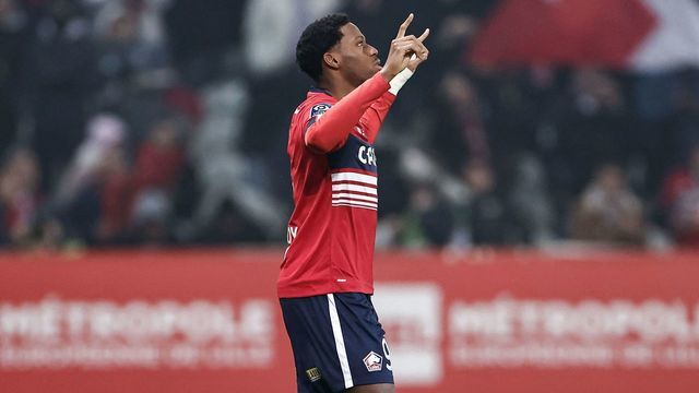Lille's Canadian forward Jonathan David celebrates after scoring his first goal during the French L1 football match between Lille LOSC and Olympique Lyonnais (OL) at Stade Pierre-Mauroy in Villeneuve-d'Ascq, northern France, on March 10, 2023.