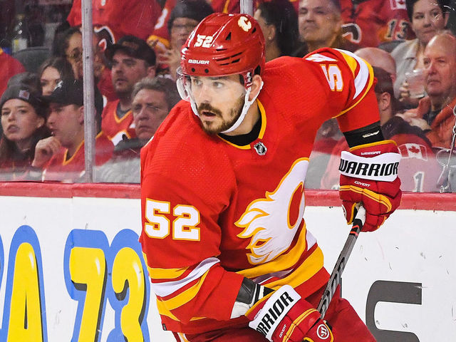 CALGARY, CANADA - FEBRUARY 18: MacKenzie Weegar #52 of the Calgary Flames in action against the New York Rangers during an NHL game at Scotiabank Saddledome on February 18, 2023 in Calgary, Alberta, Canada. The Flames defeated the Rangers 3-2 in overtime.