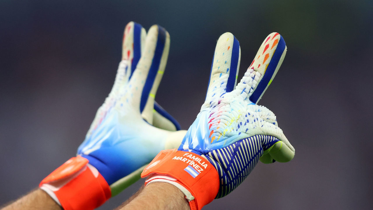 LUSAIL CITY, QATAR - DECEMBER 13: A detailed view of Emiliano Martinez of Argentina's gloves, reading 'Familia Martinez' is seen during the FIFA World Cup Qatar 2022 semi final match between Argentina and Croatia at Lusail Stadium on December 13, 2022 in Lusail City, Qatar.