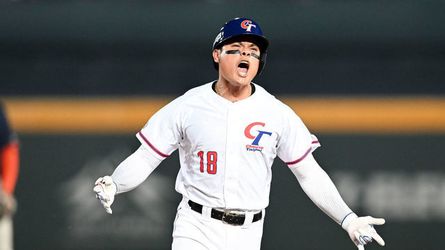 TAICHUNG, TAIWAN - MARCH 11:Yu Chang #18 of Chinese Taipei hits a grand slam at the bottom of the 2nd inning during the World Baseball Classic Pool A game between Netherlands and Chinese Taipei at Taichung Intercontinental Baseball Stadium on March 11, 2023 in Taichung, Taiwan.