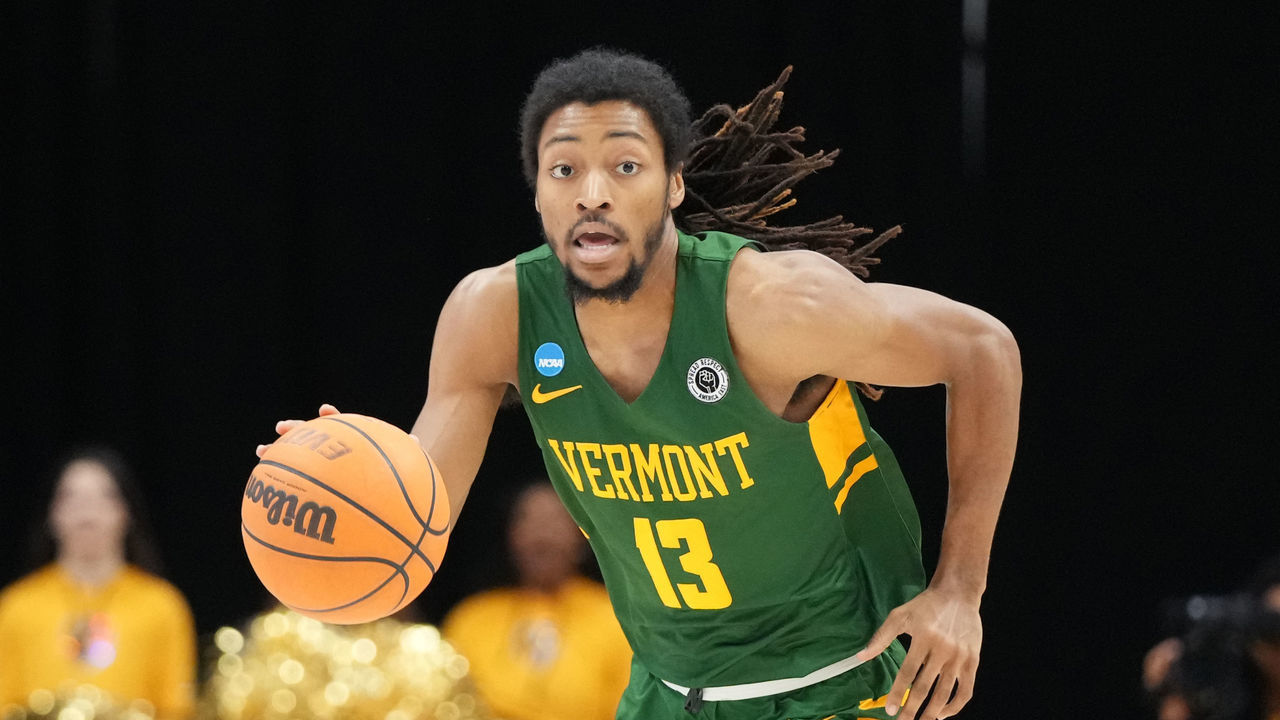 CATONSVILLE, MD - JANUARY 01: Dylan Penn #13 of the Vermont Catamounts dribbles the ball up court during a college basketball game against the UMBC Retrievers at the Chesapeake Employers Insurance Arena on January 1, 2023 in Catonsville, Maryland
