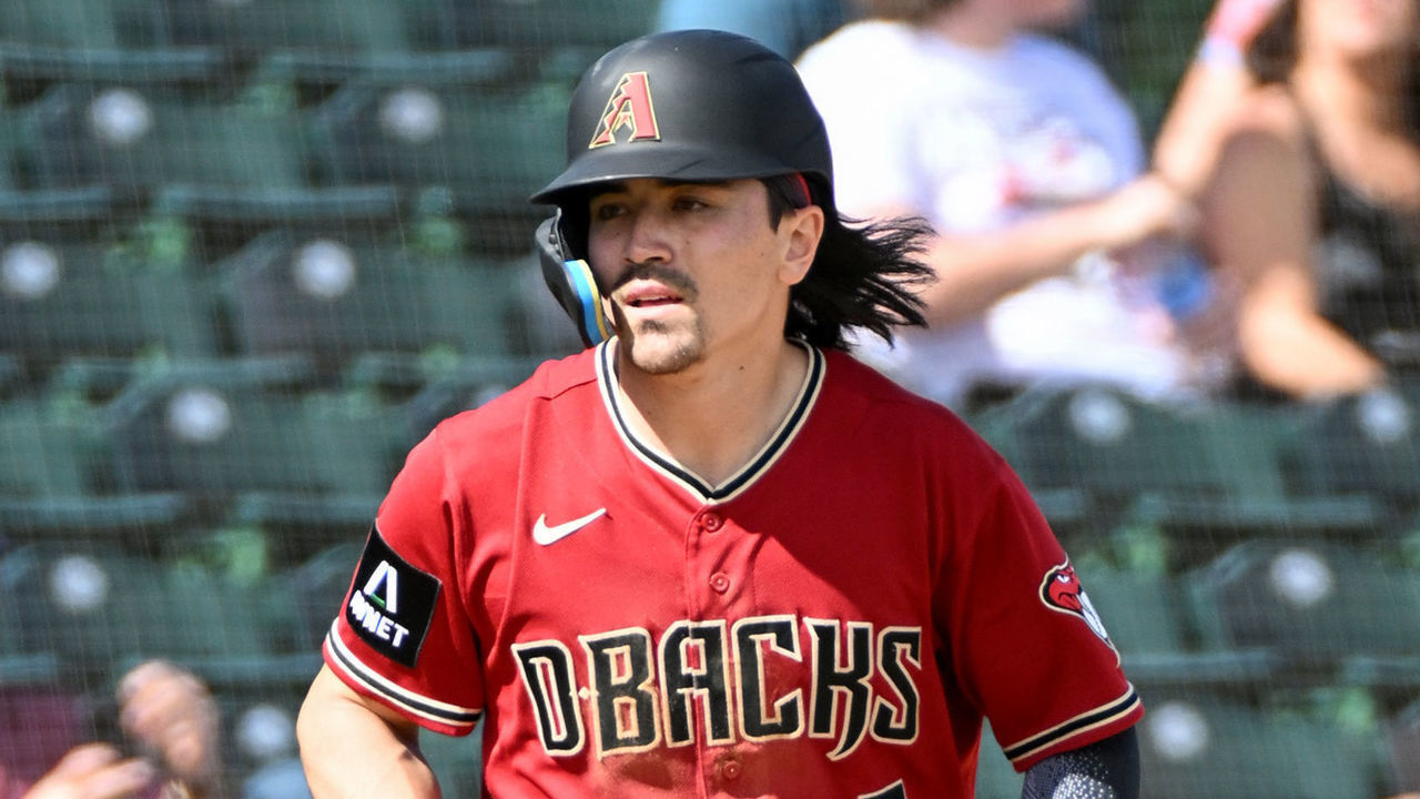MESA, ARIZONA - FEBRUARY 25, 2023: Corbin Carroll #7 of the Arizona Diamondbacks takes a lead at third base during the first inning of a spring training game against the Oakland Athletics at Hohokam Stadium on February 25, 2023 in Mesa, Arizona.