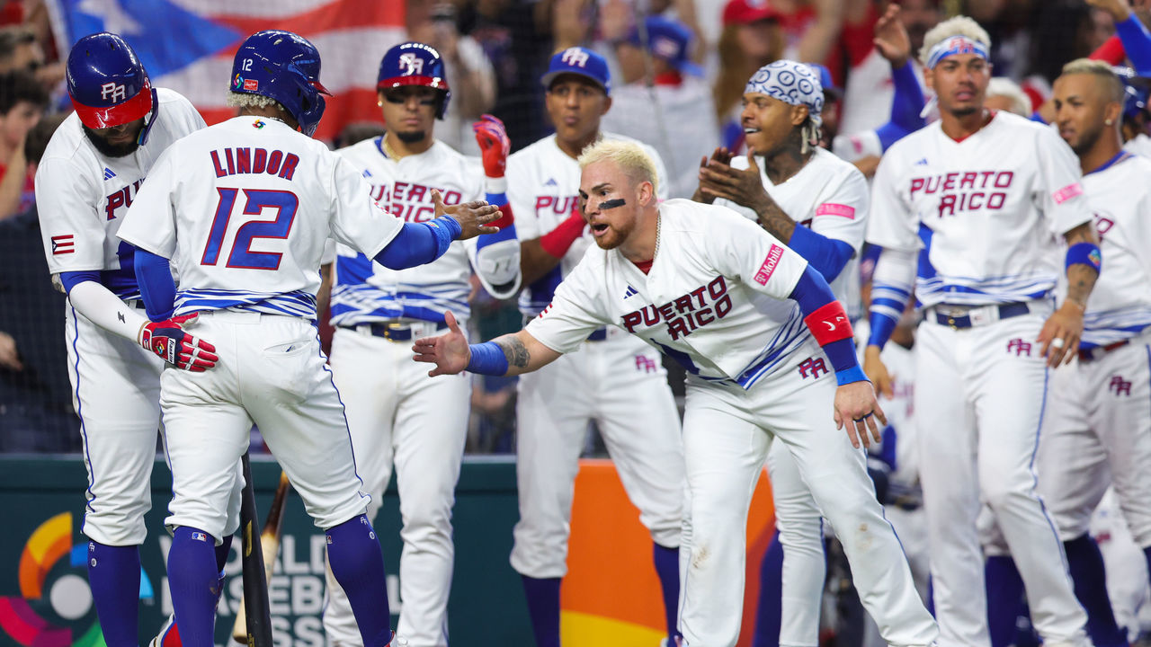 MIAMI, FLORIDA - MARCH 11: Francisco Lindor #12 of Team Puerto Rico celebrates with teammates after scoring a run against Team Nicaragua during the fifth inning at loanDepot park on March 11, 2023 in Miami, Florida.