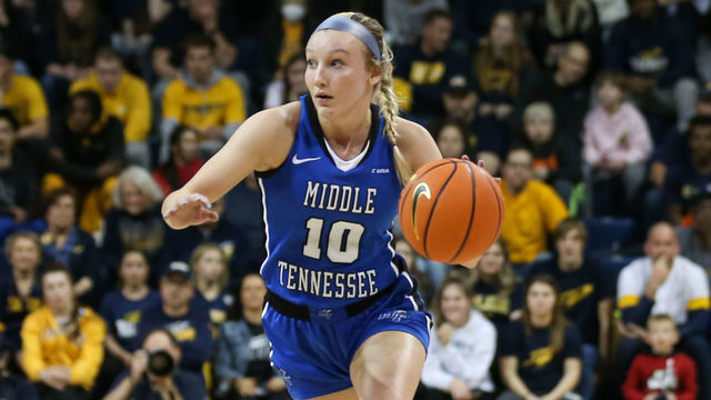 TOLEDO, OH - MARCH 28: Middle Tennessee Lady Raiders guard Jalynn Gregory (10) brings the ball up the court against Toledo Rockets guard Jayda Jansen (12) during a Womens National Invitational Tournament Elite Eight basketball game between the Middle Tennessee Lady Raiders and the Toledo Rockets on March 28, 2022 at Savage Arena in Toledo, Ohio.