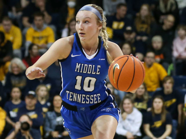TOLEDO, OH - MARCH 28: Middle Tennessee Lady Raiders guard Jalynn Gregory (10) brings the ball up the court against Toledo Rockets guard Jayda Jansen (12) during a Womens National Invitational Tournament Elite Eight basketball game between the Middle Tennessee Lady Raiders and the Toledo Rockets on March 28, 2022 at Savage Arena in Toledo, Ohio.