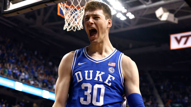 GREENSBORO, NC - MARCH 11: Kyle Filipowski #30 of the Duke Blue Devils reacts following a dunk against the Virginia Cavaliers during the second half of the ACC Basketball Tournament Championship game at Greensboro Coliseum on March 11, 2023 in Greensboro, North Carolina.