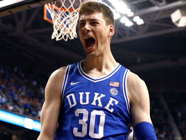 GREENSBORO, NC - MARCH 11: Kyle Filipowski #30 of the Duke Blue Devils reacts following a dunk against the Virginia Cavaliers during the second half of the ACC Basketball Tournament Championship game at Greensboro Coliseum on March 11, 2023 in Greensboro, North Carolina.