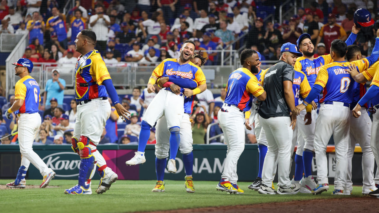 MIAMI, FL - MARCH 11: Members of Team Venezuela celebrate after Anthony Santander #25 scores in the eighth inning during Game 2 of Pool D between Team Dominican Republic and Team Venezuela at loanDepot Park on Saturday, March 11, 2023 in Miami, Florida.