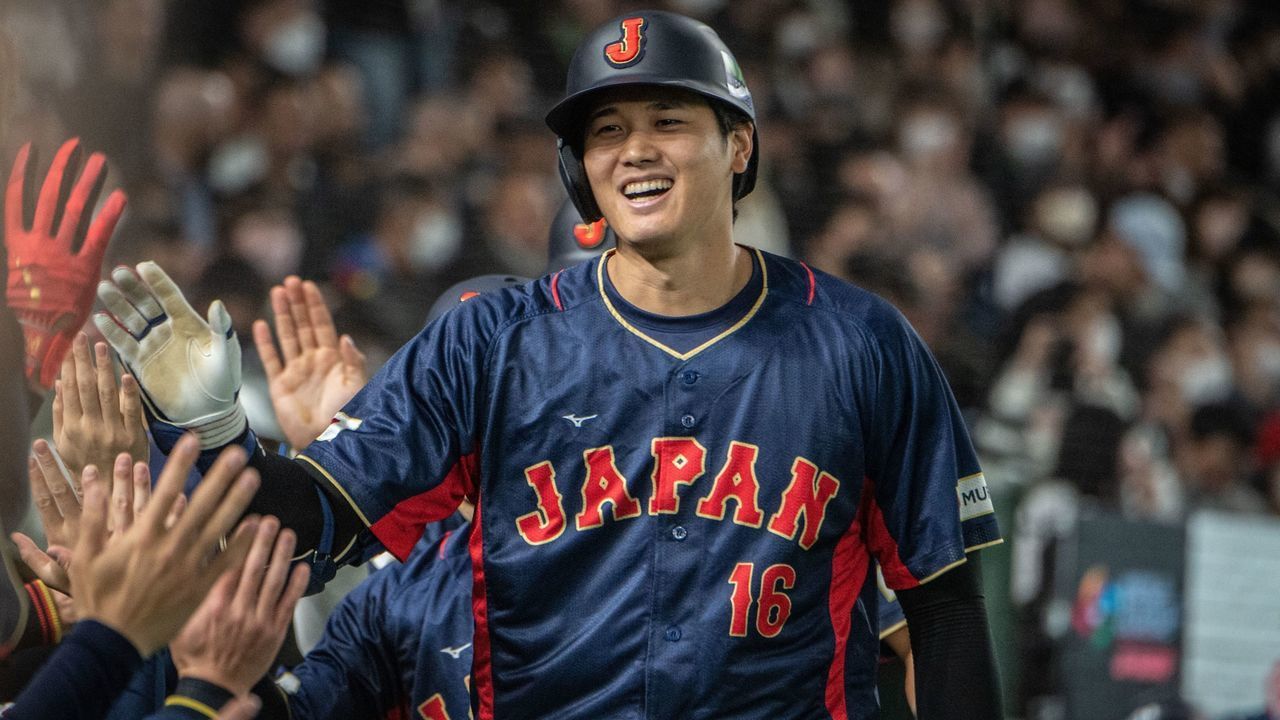 Japan's Shohei Ohtani celebrates with his teammates after hitting a three-run home run during the World Baseball Classic (WBC) Pool B round game between Japan and Australia at the Tokyo Dome in Tokyo on March 12, 2023.