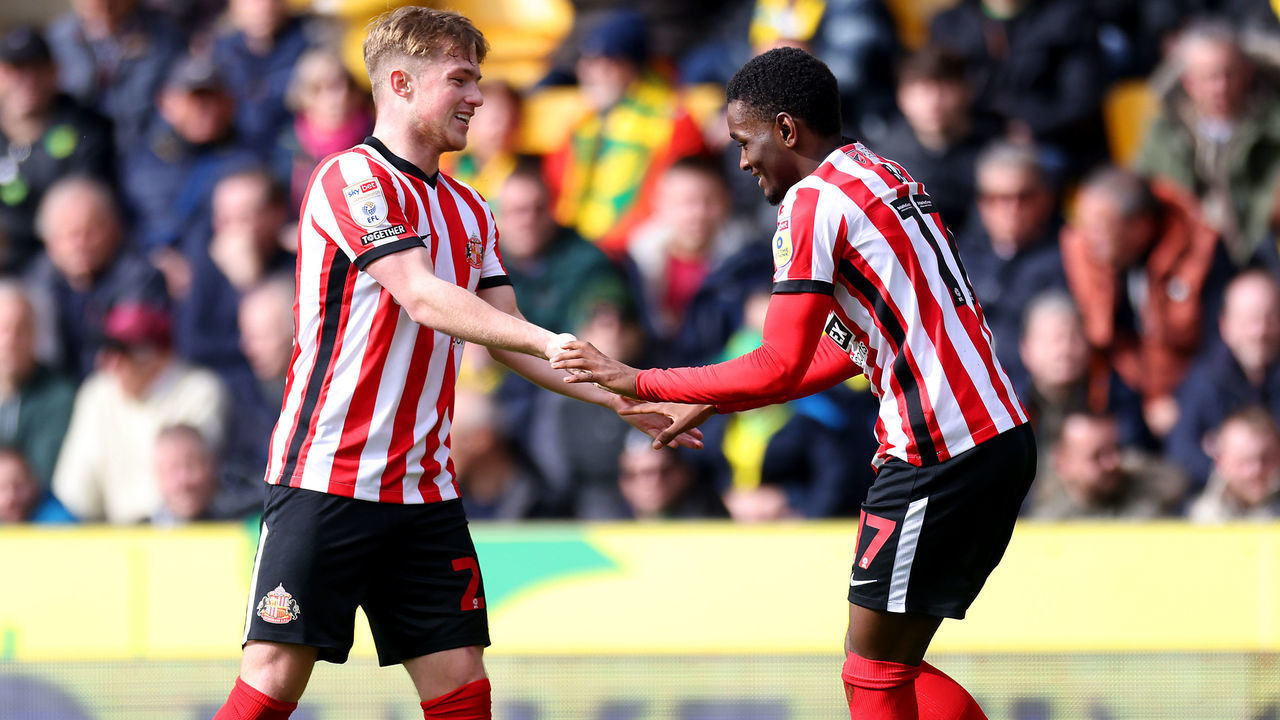 NORWICH, ENGLAND - MARCH 12: Abdoullah Ba of Sunderland celebrates scoring the opening goal with Dan Neil during the Sky Bet Championship match between Norwich City and Sunderland at Carrow Road on March 12, 2023 in Norwich, England.
