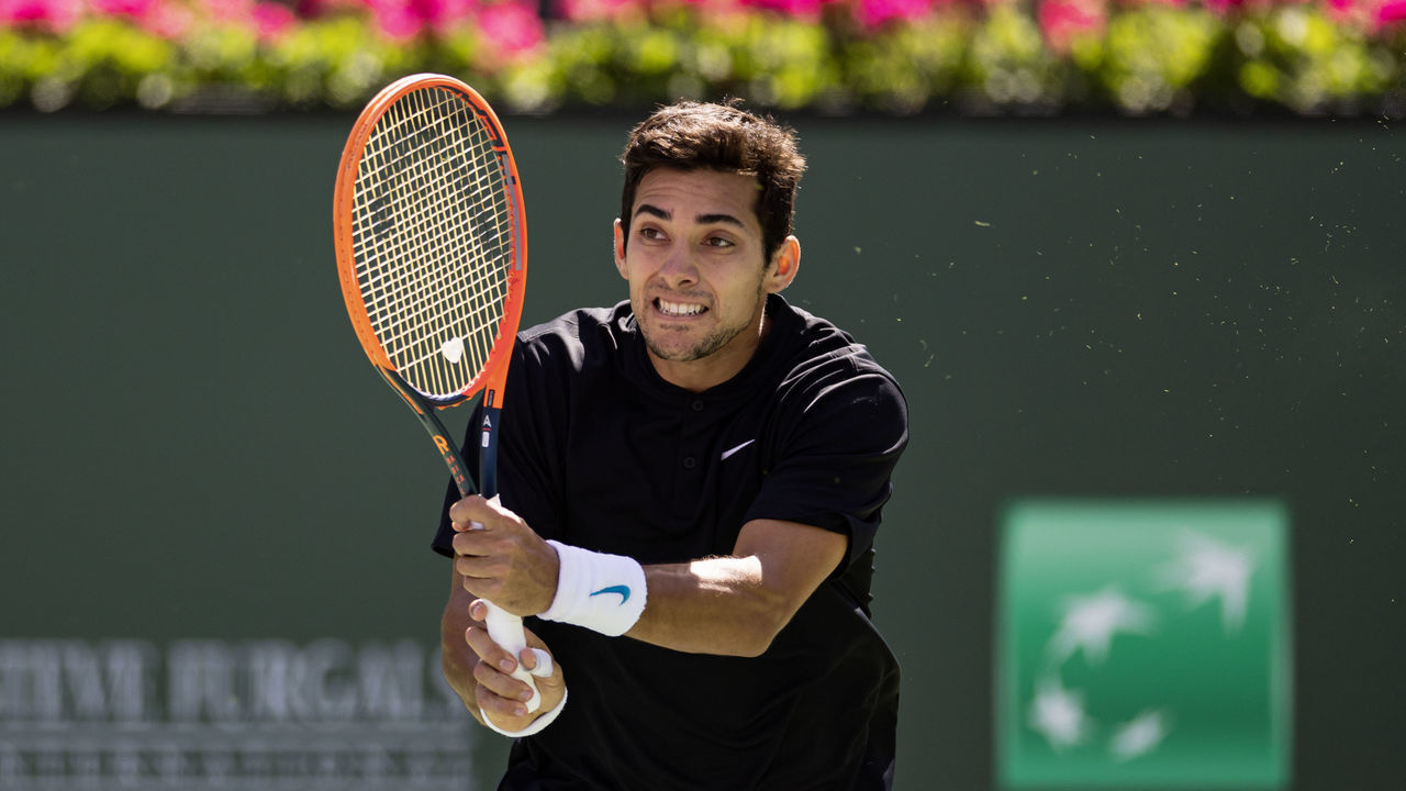 INDIAN WELLS, CALIFORNIA - MARCH 12: Cristian Garin of Chile hits a backhand against Casper Ruud of Norway in the third round of the BNP Paribas Open on March 12, 2023 in Indian Wells, California.