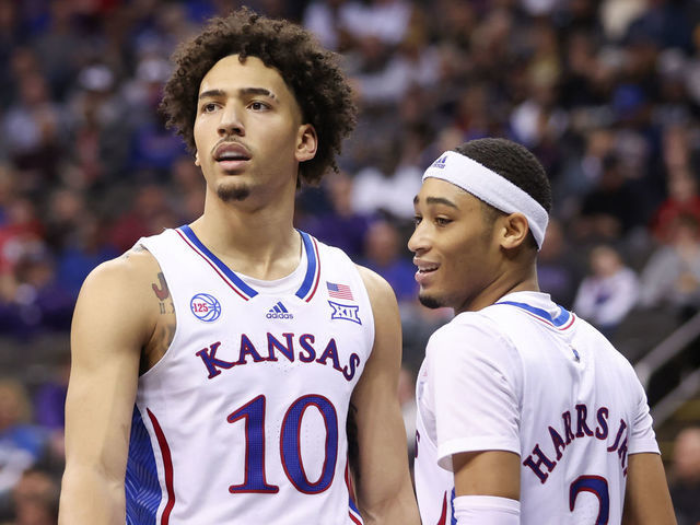 KANSAS CITY, MO - MARCH 09: Kansas Jayhawks forward Jalen Wilson (10) and guard Dajuan Harris Jr. (3) in the second half of a Big 12 Tournament quarterfinal basketball game between the West Virginia Mountaineers and the Kansas Jayhawks on March 9, 2023 at T-Mobile Center in Kansas City, MO.