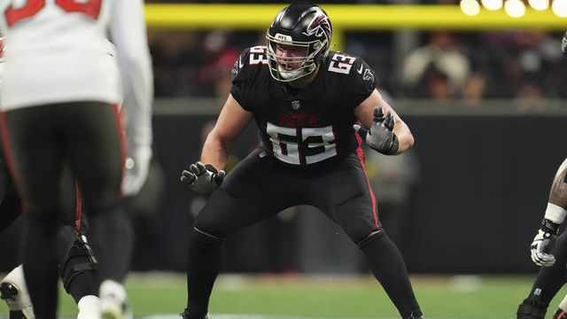 ATLANTA, GA - JANUARY 08: Chris Lindstrom #63 of the Atlanta Falcons defends against the Tampa Bay Buccaneers at Mercedes-Benz Stadium on January 8, 2023 in Atlanta, Georgia.