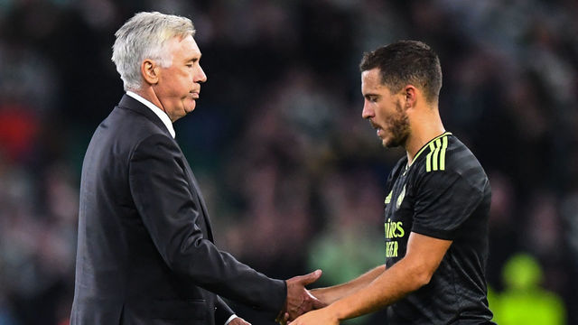 Real Madrid's Italian coach Carlo Ancelotti (L) congratulates Real Madrid's Belgian forward Eden Hazard at the end the UEFA Champions League Group F football match between Celtic and Real Madrid, at the Celtic Park stadium, in Glasgow, on September 6, 2022. - Real Madrid won 3 - 0 against Celtic.