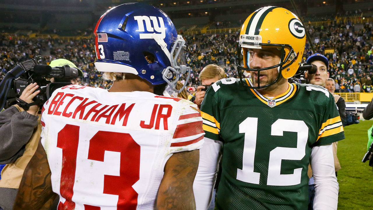 GREEN BAY, WI - OCTOBER 09: Aaron Rodgers #12 of the Green Bay Packers meets with Odell Beckham Jr. #13 of the New York Giants after the game at Lambeau Field on October 9, 2016 in Green Bay, Wisconsin.