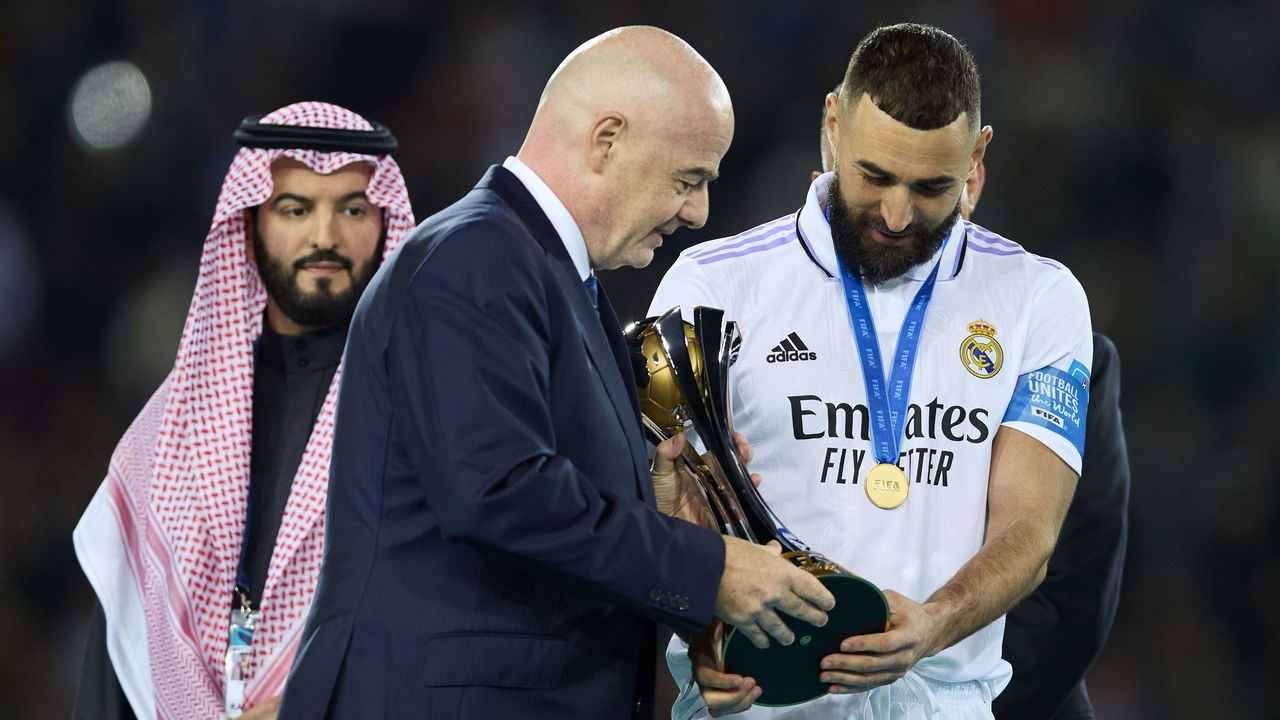 RABAT, MOROCCO - FEBRUARY 11: Gianni Infantino, President of FIFA hands the FIFA Club World Cup Morocco 2022 Trophy to Karim Benzema of Real Madrid after the FIFA Club World Cup Morocco 2022 Final match between Real Madrid v Al Hilal at Prince Moulay Abdellah on February 11, 2023 in Rabat, Morocco.