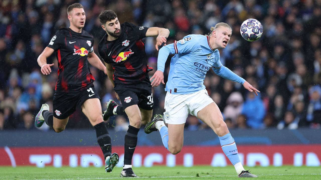 MANCHESTER, ENGLAND - MARCH 14: Erling Haaland of Manchester City holds off a challenge from Josko Gvardiol and Willi Orban of RB Leipzig during the UEFA Champions League round of 16 leg two match between Manchester City and RB Leipzig at Etihad Stadium on March 14, 2023 in Manchester, England.