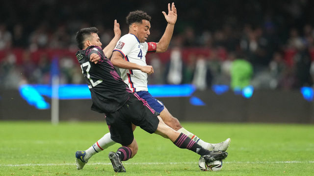 MEXICO CITY, MEXICO - MARCH 24: Tyler Adams #4 of the United States battles with Hirving Lozano #22 of Mexico during a FIFA World Cup qualifier game between Mexico and USMNT at Azteca Stadium on March 24, 2022 in Mexico City, Mexico.