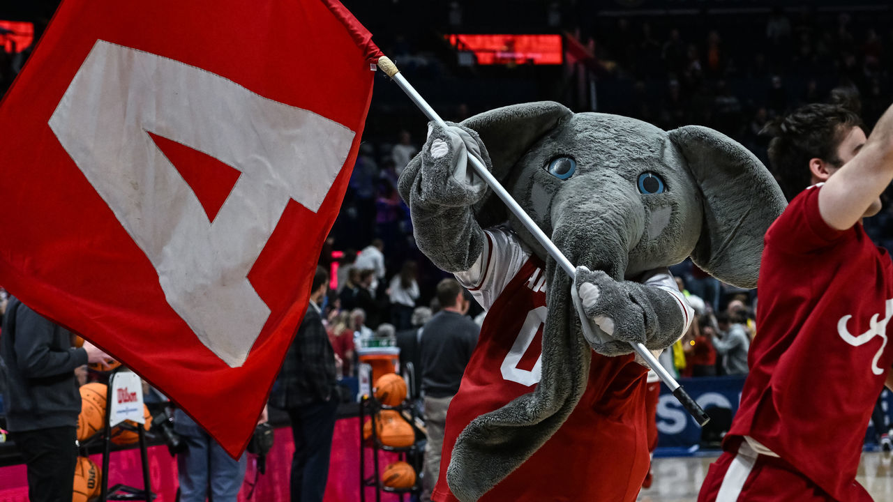 NASHVILLE, TN - MARCH 11: Alabama Crimson Tide mascot Big Al leads the team onto the court before an SEC Mens Basketball Tournament game between the Alabama Crimson Tide and the Missouri Tigers on March 11, 2023 at Bridgestone Arena in Nashville, TN.