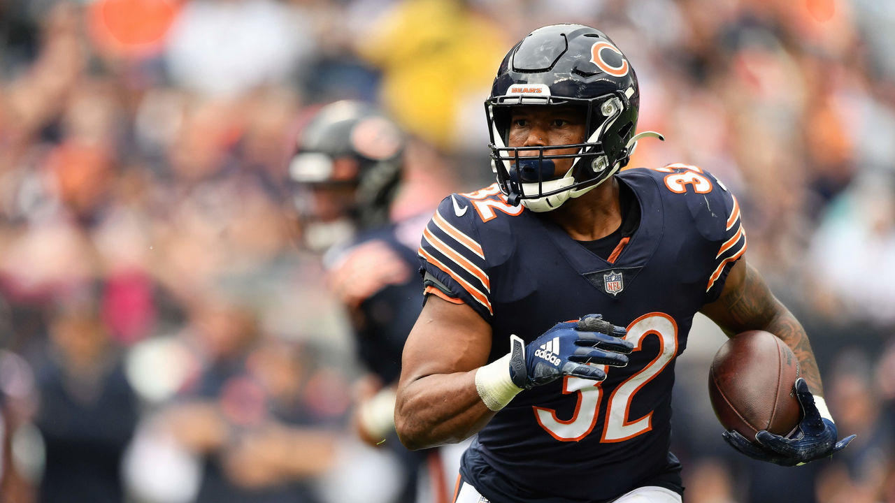 CHICAGO, ILLINOIS - OCTOBER 03: David Montgomery #32 of the Chicago Bears runs with the ball against the Detroit Lions at Soldier Field on October 03, 2021 in Chicago, Illinois.