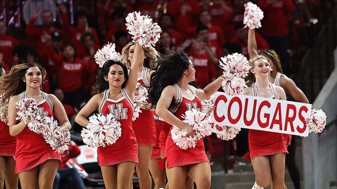 HOUSTON, TEXAS - FEBRUARY 08: Houston Cougar cheerleaders perform at Fertitta Center on February 08, 2023 in Houston, Texas.