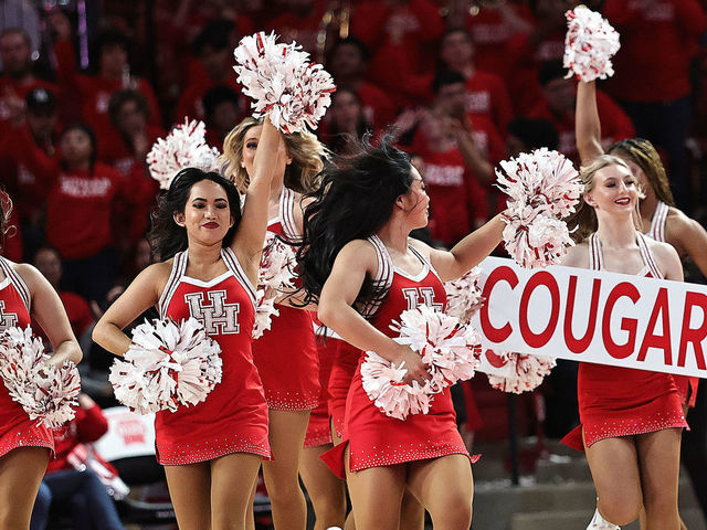 HOUSTON, TEXAS - FEBRUARY 08: Houston Cougar cheerleaders perform at Fertitta Center on February 08, 2023 in Houston, Texas.
