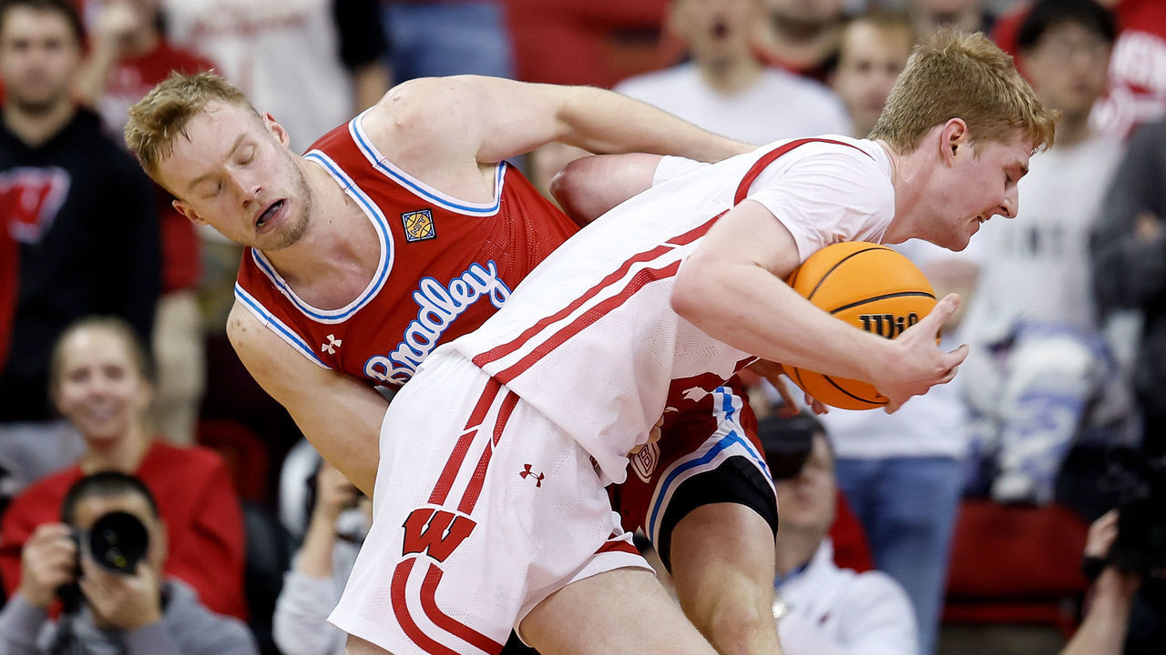 MADISON, WISCONSIN - MARCH 14: Steven Crowl #22 of the Wisconsin Badgers drives to the basket on Rienk Mast #51 of the Bradley Braves during the second half of the game at Kohl Center on March 14, 2023 in Madison, Wisconsin.