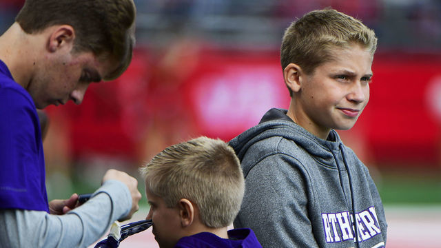 PISCATAWAY, NJ - OCTOBER 20: John Phillips, 12, son of Northwestern's Athletic Director, Jim Phillips, watches during the fourth quarter between the Rutgers Scarlet Knights and the Northwestern Wildcats on October 20, 2018 in Piscataway, New Jersey. John rose to fame becoming an internet sensation and nicknamed "Northwestern Kid" for his reaction on national television against Gonzaga during March Madness in 2017. Northwestern won 18-15.