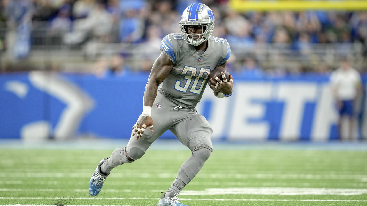 DETROIT, MICHIGAN - NOVEMBER 24: Jamaal Williams #30 of the Detroit Lions runs the ball against the Buffalo Bills at Ford Field on November 24, 2022 in Detroit, Michigan.