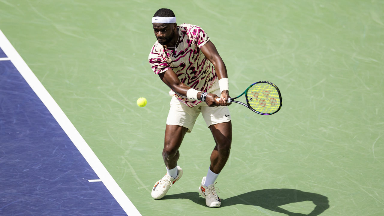 INDIAN WELLS, CALIFORNIA - MARCH 15: Frances Tiafoe of the United States hits a backhand against Cameron Norrie of Great Britain in the quarter-finals of the BNP Paribas Open on March 15, 2023 in Indian Wells, California.