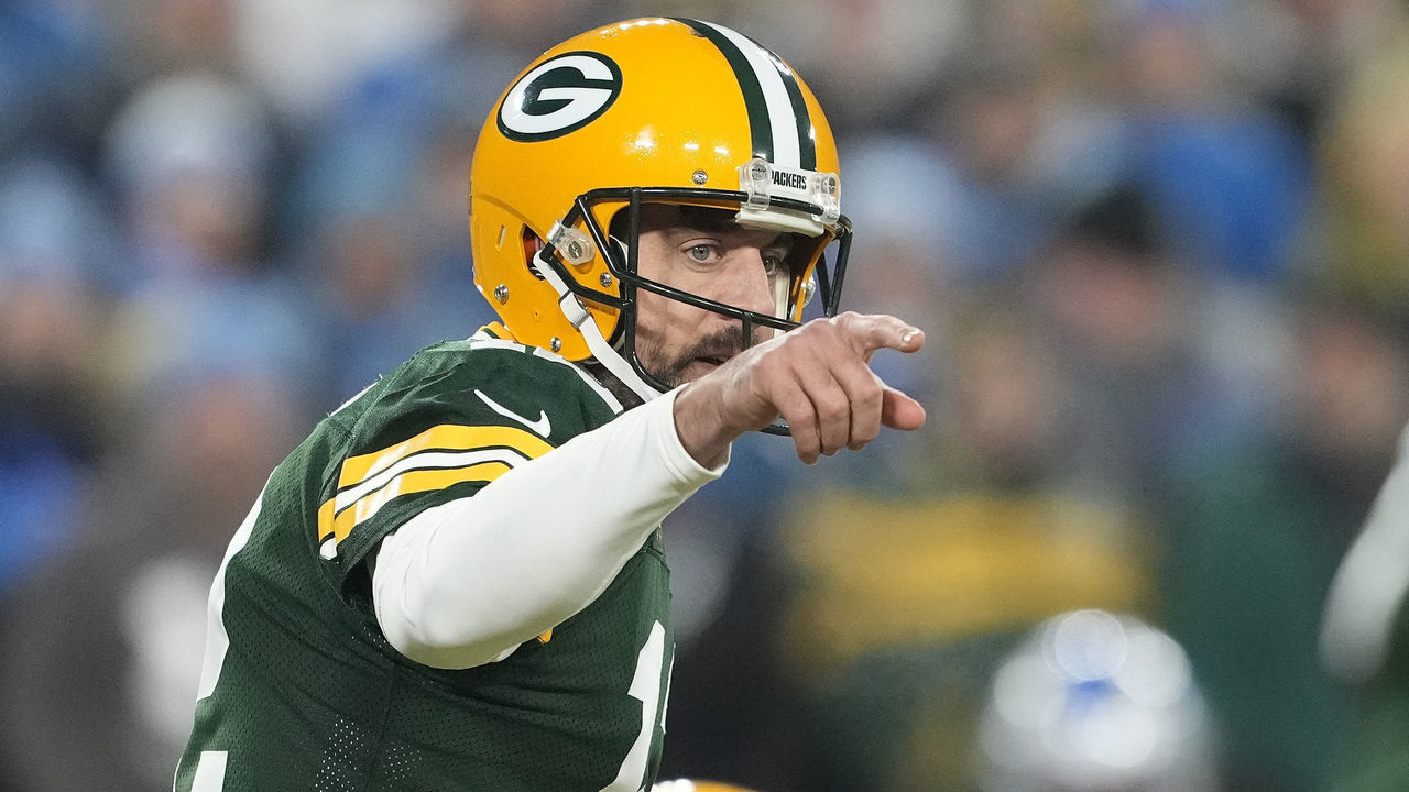 GREEN BAY, WISCONSIN - JANUARY 08: Aaron Rodgers #12 of the Green Bay Packers signals at the line of scrimmage in the first half against the Detroit Lions at Lambeau Field on January 08, 2023 in Green Bay, Wisconsin.
