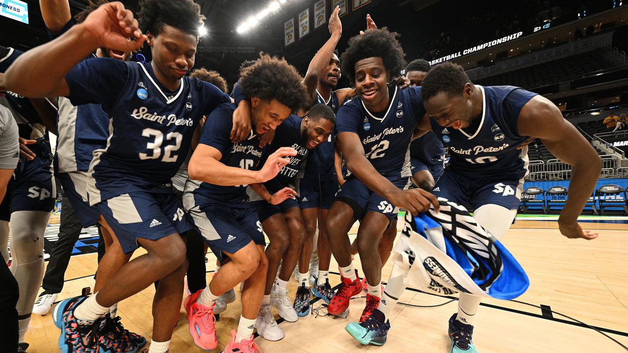 INDIANAPOLIS, IN - MARCH 19: St. Peter's Peacocks players celebrate after they defeated the Murray State Racers in the second round of the 2022 NCAA Men's Basketball Tournament held at Gainbridge Fieldhouse on March 19, 2022 in Indianapolis, Indiana. Murray State won 70-60.
