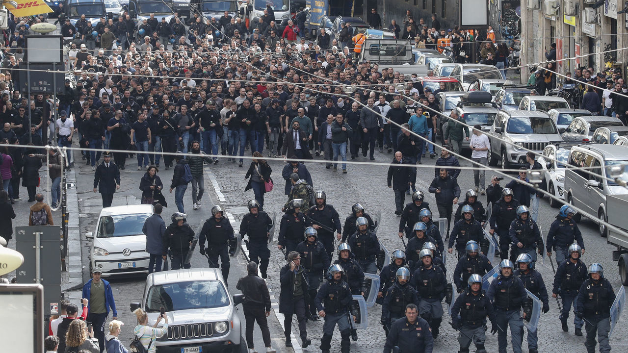 NAPLES, CAMPANIA, ITALY - 2023/03/15: Italian police follow Eintracht Frankfurt fans walking through the streets of the city of Naples before the UEFA Champions League round of 16 return match between SSC Napoli and Eintracht Frankfurt.