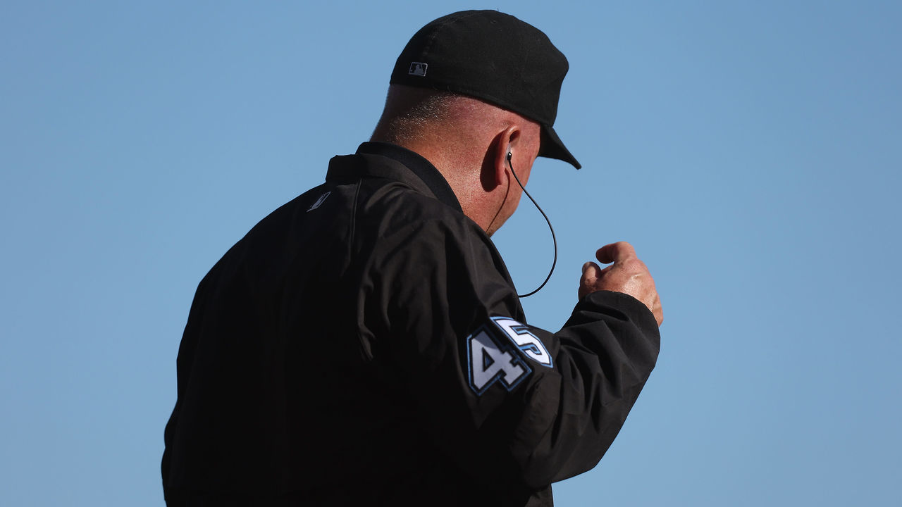 SAN FRANCISCO, CALIFORNIA - OCTOBER 02: Crew chief umpire Jeff Nelson #45 puts in his earpiece for a replay review during the game between the San Francisco Giants and the Arizona Diamondbacks at Oracle Park on October 02, 2022 in San Francisco, California.