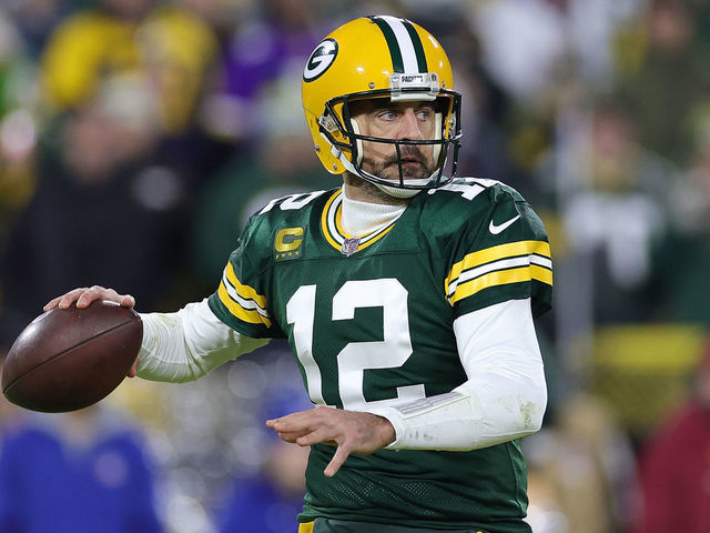 Green Bay Packers quarterback Aaron Rodgers (12) looks to pass the