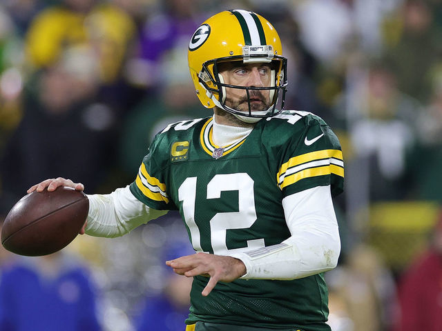 GREEN BAY, WISCONSIN - JANUARY 01: Aaron Rodgers #12 of the Green Bay Packers looks to pass during a game against the Minnesota Vikings at Lambeau Field on January 01, 2023 in Green Bay, Wisconsin. The Packers defeated the Vikings 41-17.