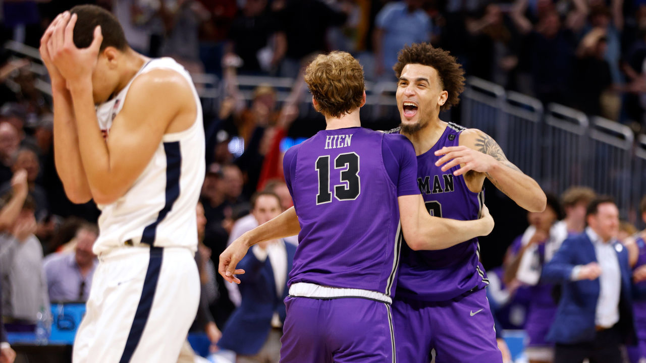 ORLANDO, FL - MARCH 16: Garrett Hien #13 and Jalen Slawson #20 of the Furman Paladins celebrate near the end of their game against the Virginia Cavaliers in the first round of the NCAA Men's Basketball Tournament at Amway Center on March 16, 2023 in Orlando, Florida. Furman won 68-76.