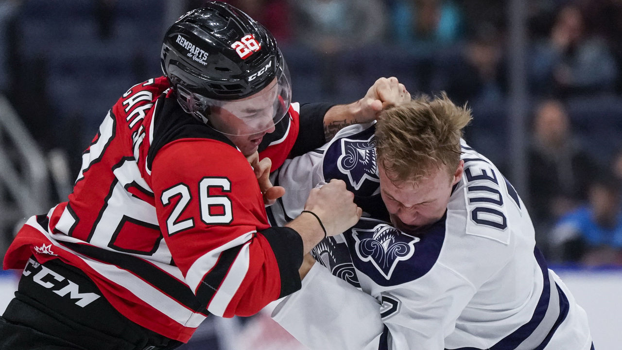 QUEBEC CITY, QC - OCTOBER 18: Nathan Ouellet #7 of the Rimouski Oceanic and Thomas Caron #26 of the Quebec Remparts fight during their QMJHL hockey game at the Videotron Center on October 18, 2019 in Quebec City, Quebec, Canada.
