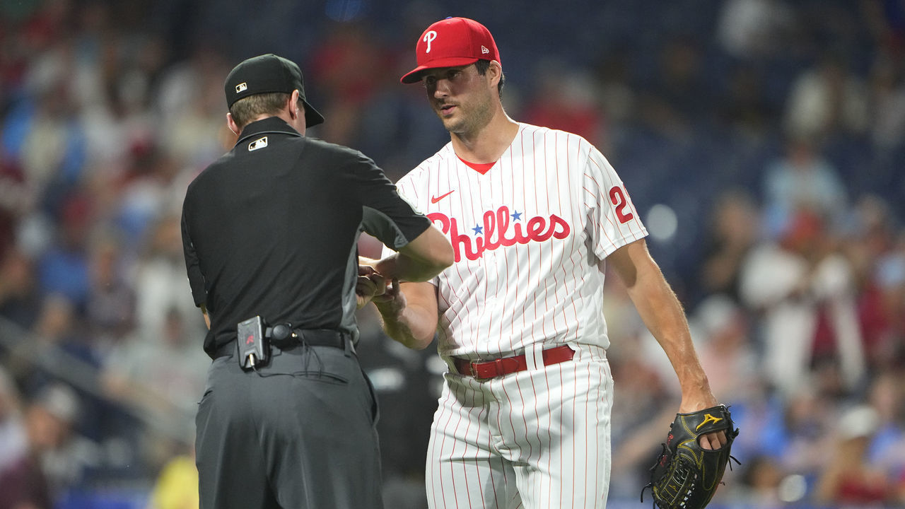 PHILADELPHIA, PA - JUNE 29: The umpire checks Philadelphia Phillies Pitcher Mark Appel (22) for sticky stuff during the ninth inning between the Atlanta Braves and Philadelphia Phillies on June 29, 2022, at Citizens Bank Park in Philadelphia, PA.