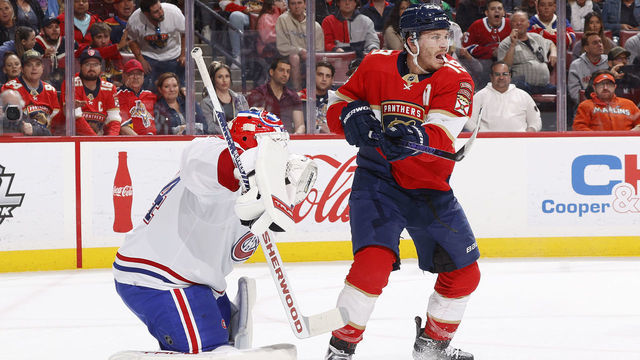 SUNRISE, FL - MARCH 16: Matthew Tkachuk #19 of the Florida Panthers attempts to tip the puck past Goaltender Jake Allen #34 of the Montreal Canadiens during first period action at the FLA Live Arena on March 16, 2023 in Sunrise, Florida.