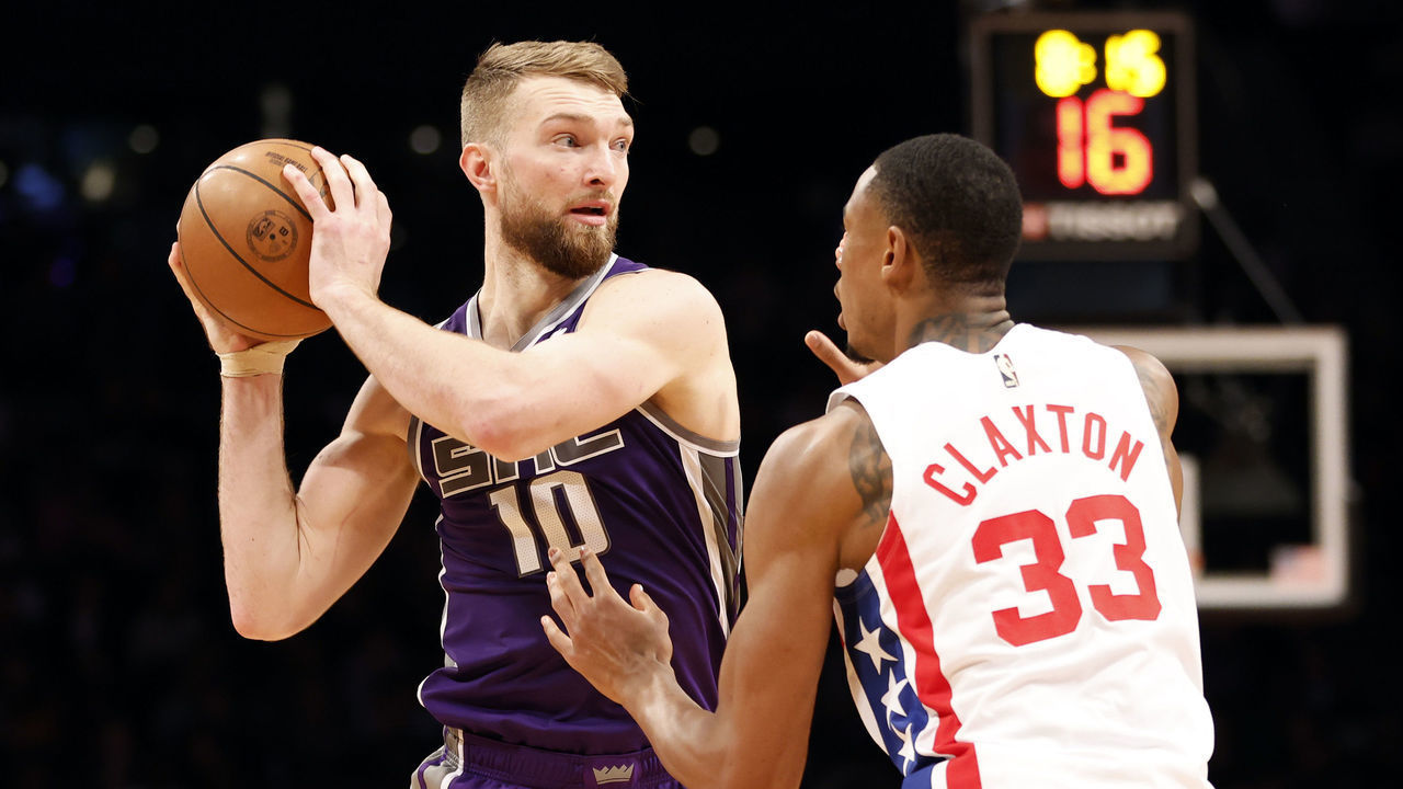 NEW YORK, NEW YORK - MARCH 16: Domantas Sabonis #10 of the Sacramento Kings looks to pass as Nic Claxton #33 of the Brooklyn Nets defends during the second half at Barclays Center on March 16, 2023 in New York City. The Kings won 101-96. NOTE TO USER: User expressly acknowledges and agrees that, by downloading and/or using this photograph, User is consenting to the terms and conditions of the Getty Images License Agreement.