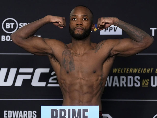 LONDON, ENGLAND - MARCH 17: Leon Edwards of Jamaica poses on the scale during the UFC 286 official weigh-in at Hilton London Canary Wharf on March 17, 2023 in London, England.