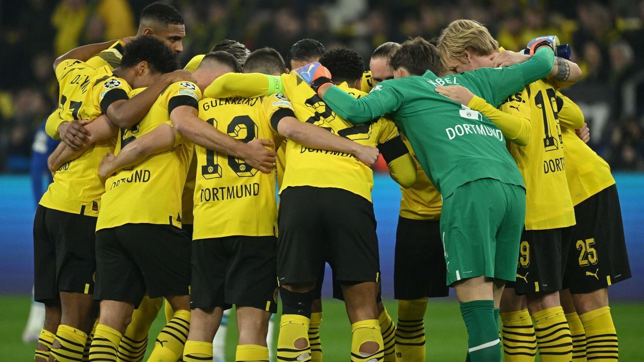 Dortmund players make a pre-match huddle prior to the UEFA Champions League, first-leg, round of 16 football match BVB Borussia Dortmund vs Chelsea FC, in Dortmund, western Germany, on February 15, 2023.