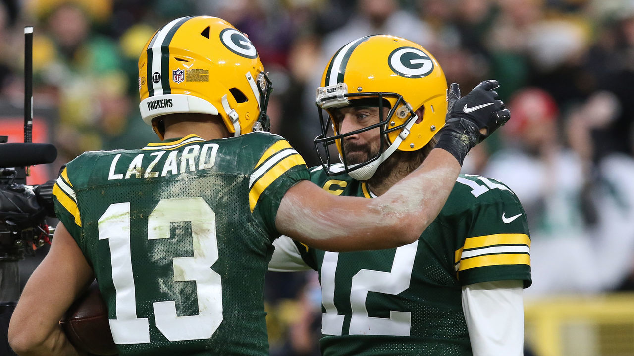 GREEN BAY, WI - DECEMBER 25: Green Bay Packers wide receiver Allen Lazard (13) celebrates with Green Bay Packers quarterback Aaron Rodgers (12) during a game between the Green Bay Packers and the Cleveland Browns on December 25, 2021 at Lambeau Field in Green Bay, WI.
