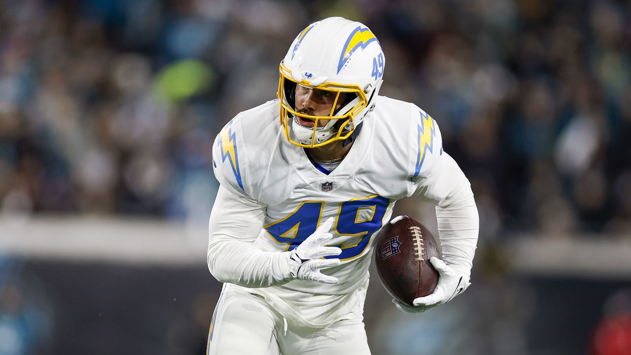 JACKSONVILLE, FL - JANUARY 14: Los Angeles Chargers linebacker Drue Tranquill (49) returns an interception during the game between the Los Angeles Chargers and the Jacksonville Jaguars on January 14, 2023 at TIAA Bank Field in Jacksonville, Fl.