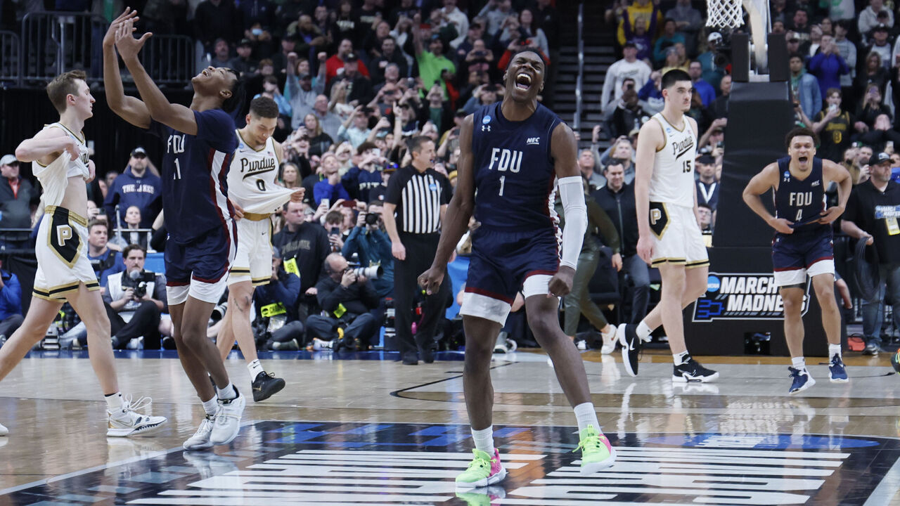 COLUMBUS, OH - MARCH 17: Players from the Fairleigh Dickinson Knights celebrate their win over the Purdue Boilermakers in the first round of the 2022 NCAA Men's Basketball Tournament held at Nationwide Arena on March 17, 2023 in Columbus, Ohio.