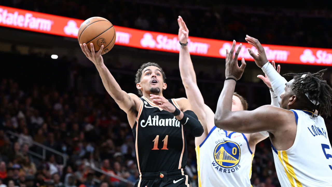ATLANTA, GA - MARCH 17: Trae Young #11 of the Atlanta Hawks drives to the basket during the game against the Golden State Warriors on March 17, 2023 at State Farm Arena in Atlanta, Georgia. NOTE TO USER: User expressly acknowledges and agrees that, by downloading and/or using this Photograph, user is consenting to the terms and conditions of the Getty Images License Agreement. Mandatory Copyright Notice: Copyright 2023 NBAE