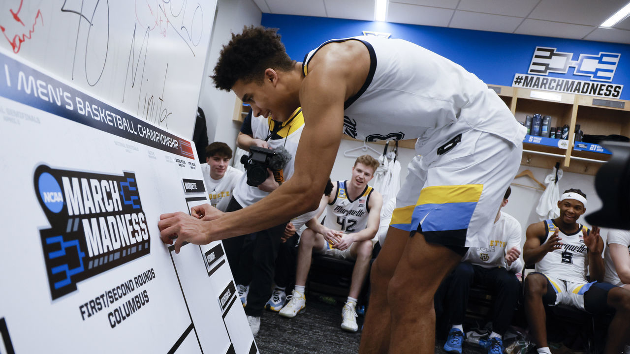 COLUMBUS, OH - MARCH 17: Oso Ighodaro #13 places Marquette into the next slot of the bracket after the teams win over Vermont Catamounts during the first round of the 2023 NCAA Men's Basketball Tournament held at Nationwide Arena on March 17, 2023 in Columbus, Ohio.